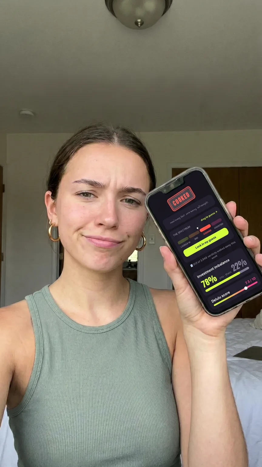 Creator showing off a Dumpt COOKED verdict on her phone